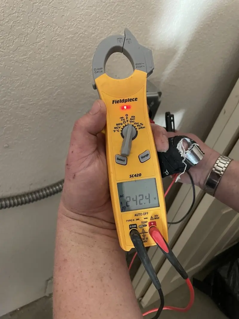 Voltage testing with clamp meter during Hot Tub / Pool Electrical Wiring in Warrington